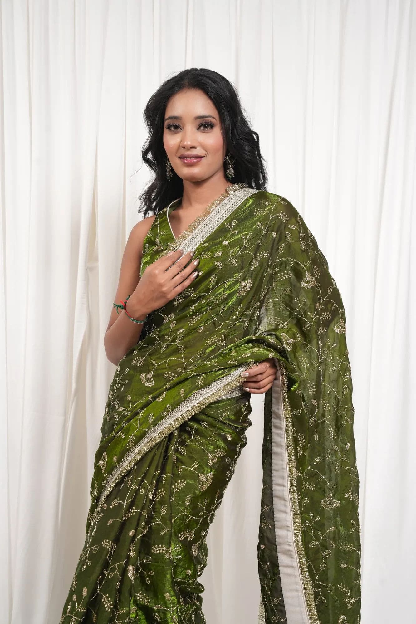 Sage Green Saree with Intricate Gold Botanical Embroidery