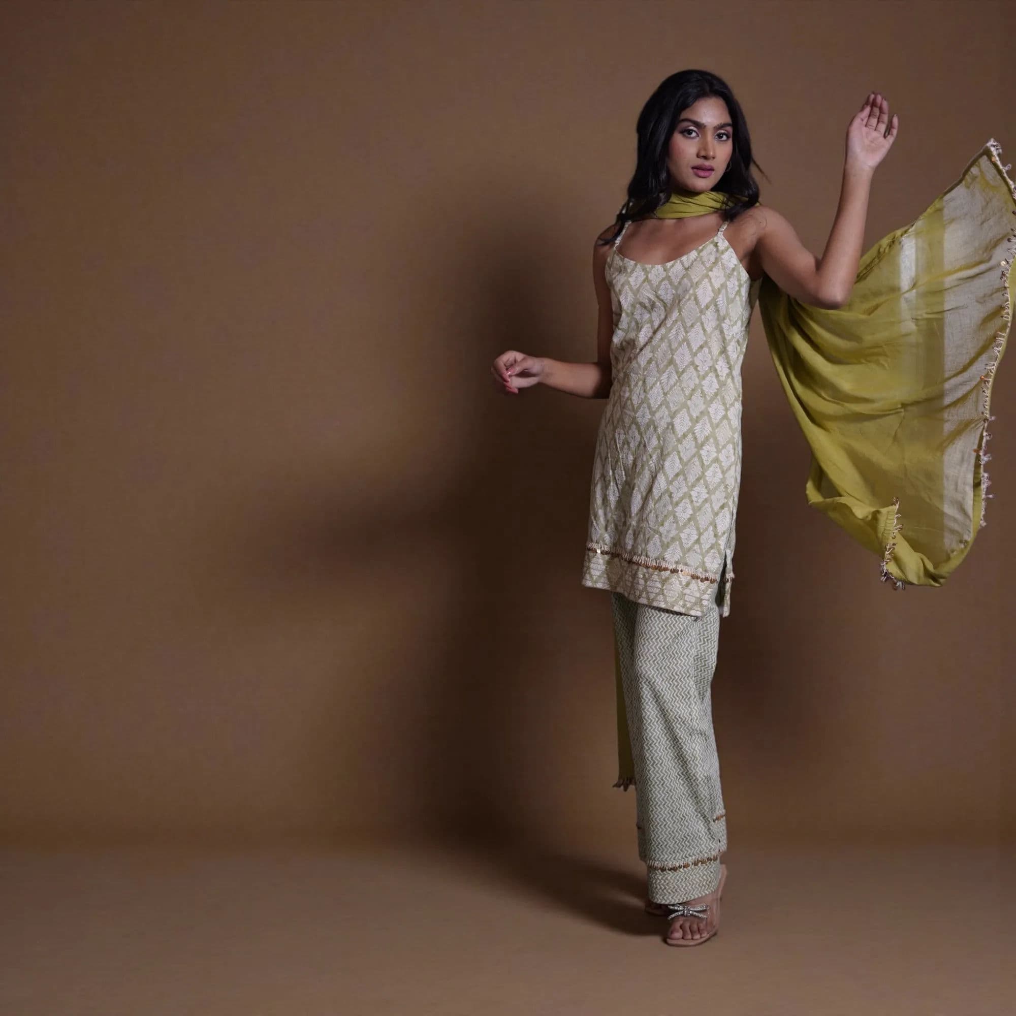 Cream and gold geometric patterned suit with white dupatta