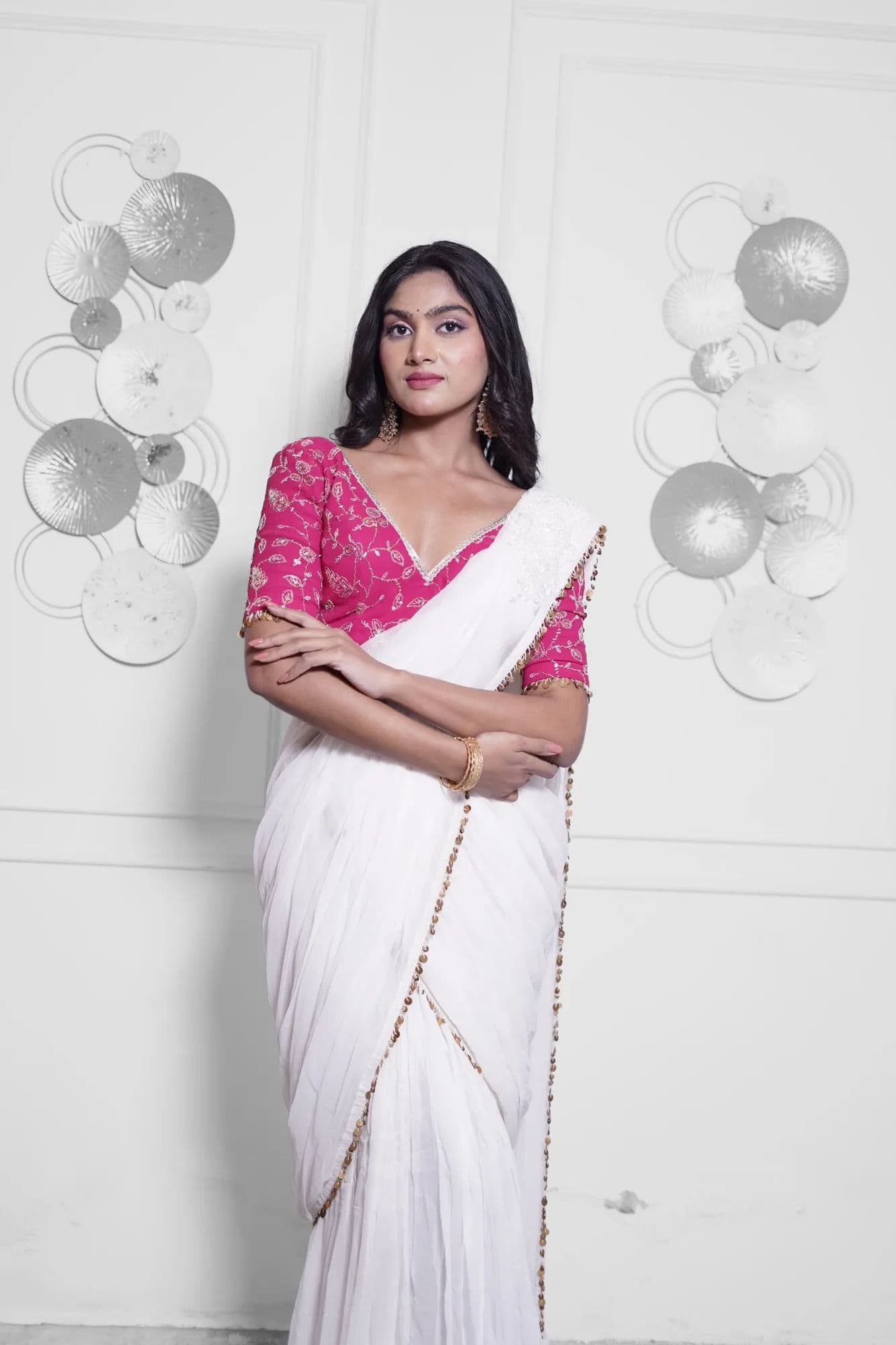 White saree with pink brocade blouse and beaded trim